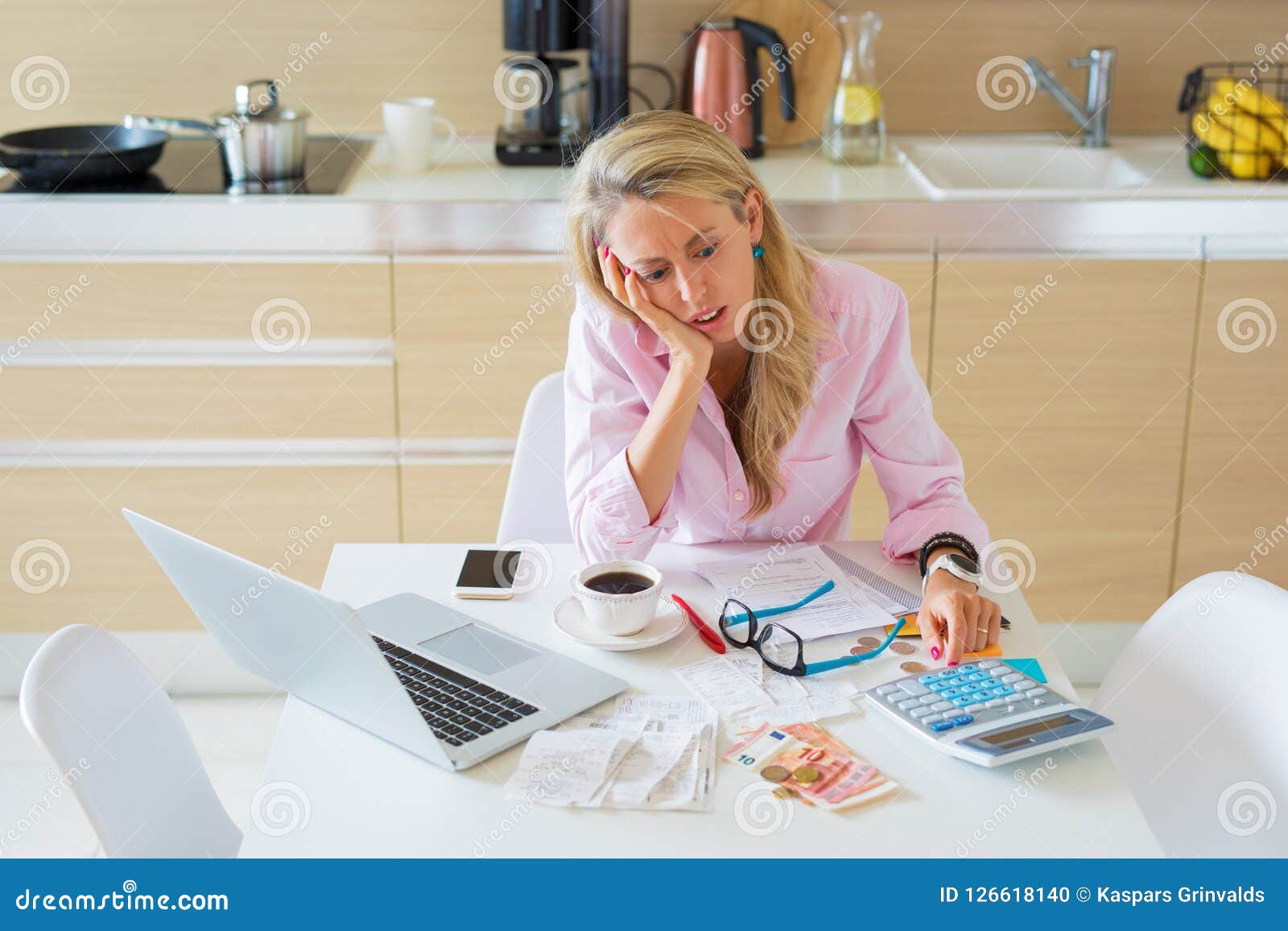 stressed woman having financial problems and bills to pay