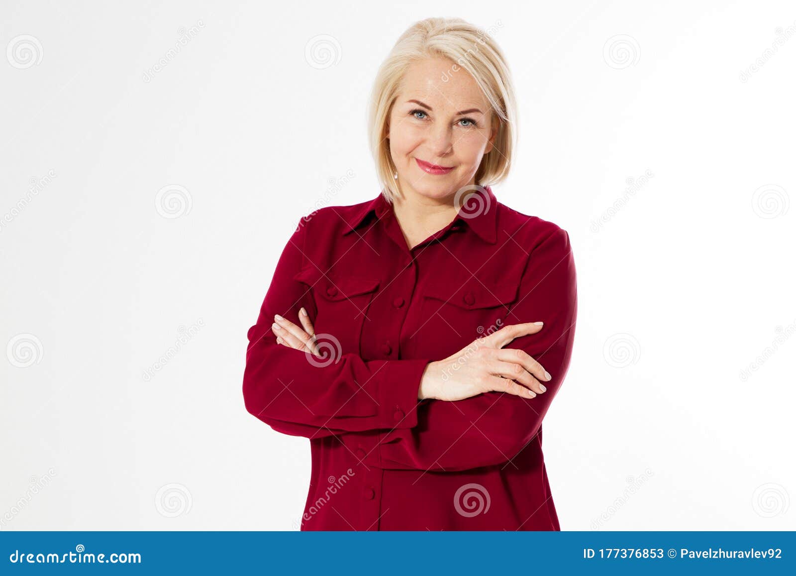 Middle-aged woman with crossed arms, middle age cute woman posing