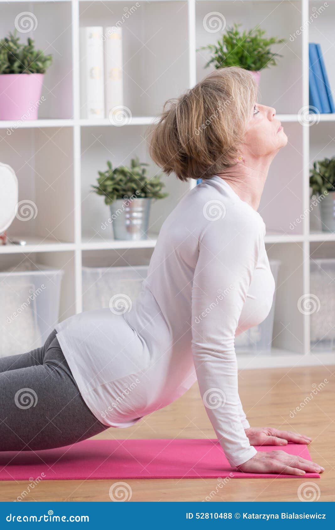 middle-aged woman doing yoga - Stock Image - F003/8654 - Science Photo  Library
