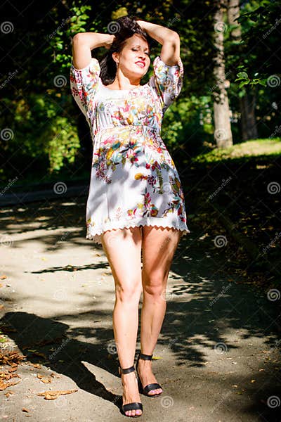 Chubby Middle Age Woman in Park in Romantic Dress Stock Photo - Image ...