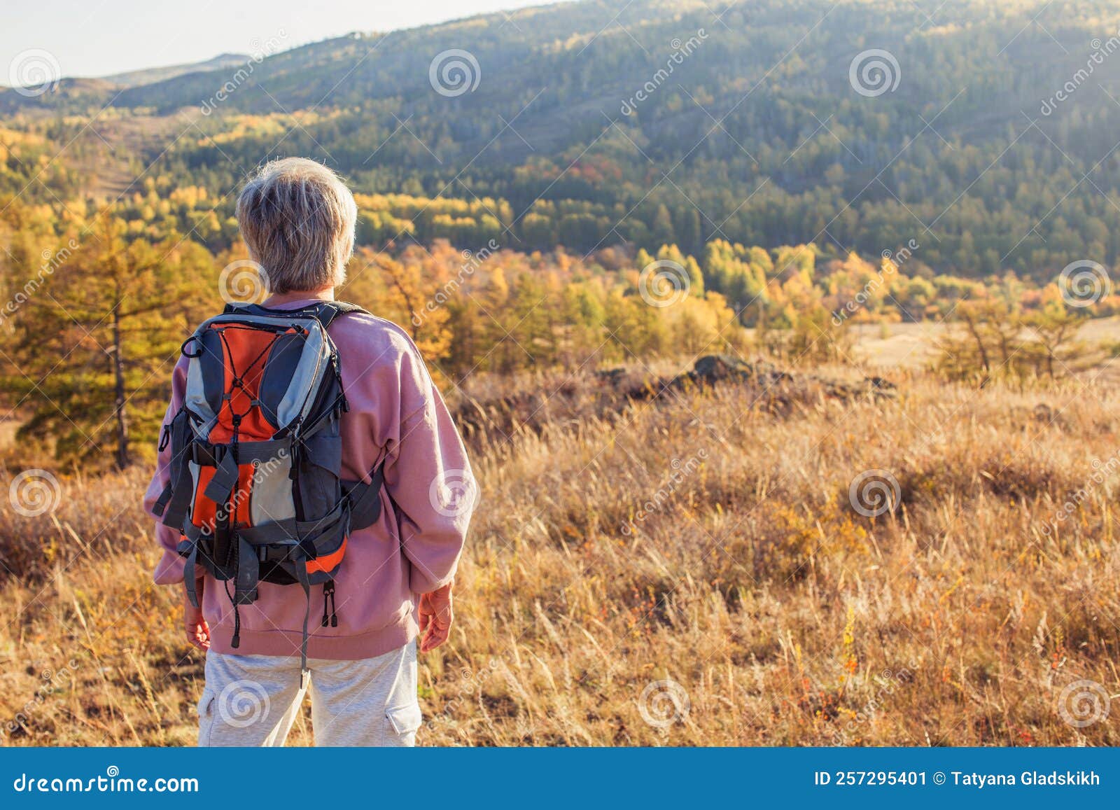 Middle Aged Woman Hiking And Going Camping In Autumn Forest Stock Image managing-menopause-your-health