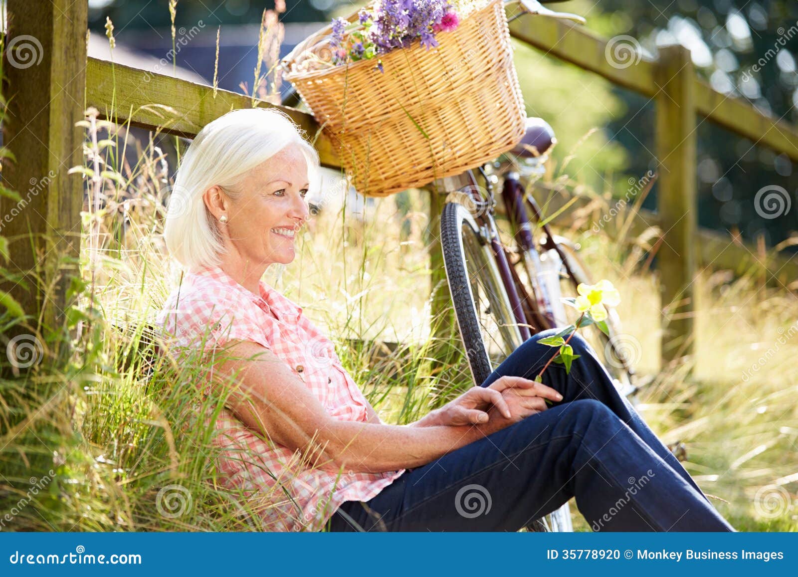 Middle Aged Woman Relaxing on Country Cycle Ride Stock Photo - Image of ...
