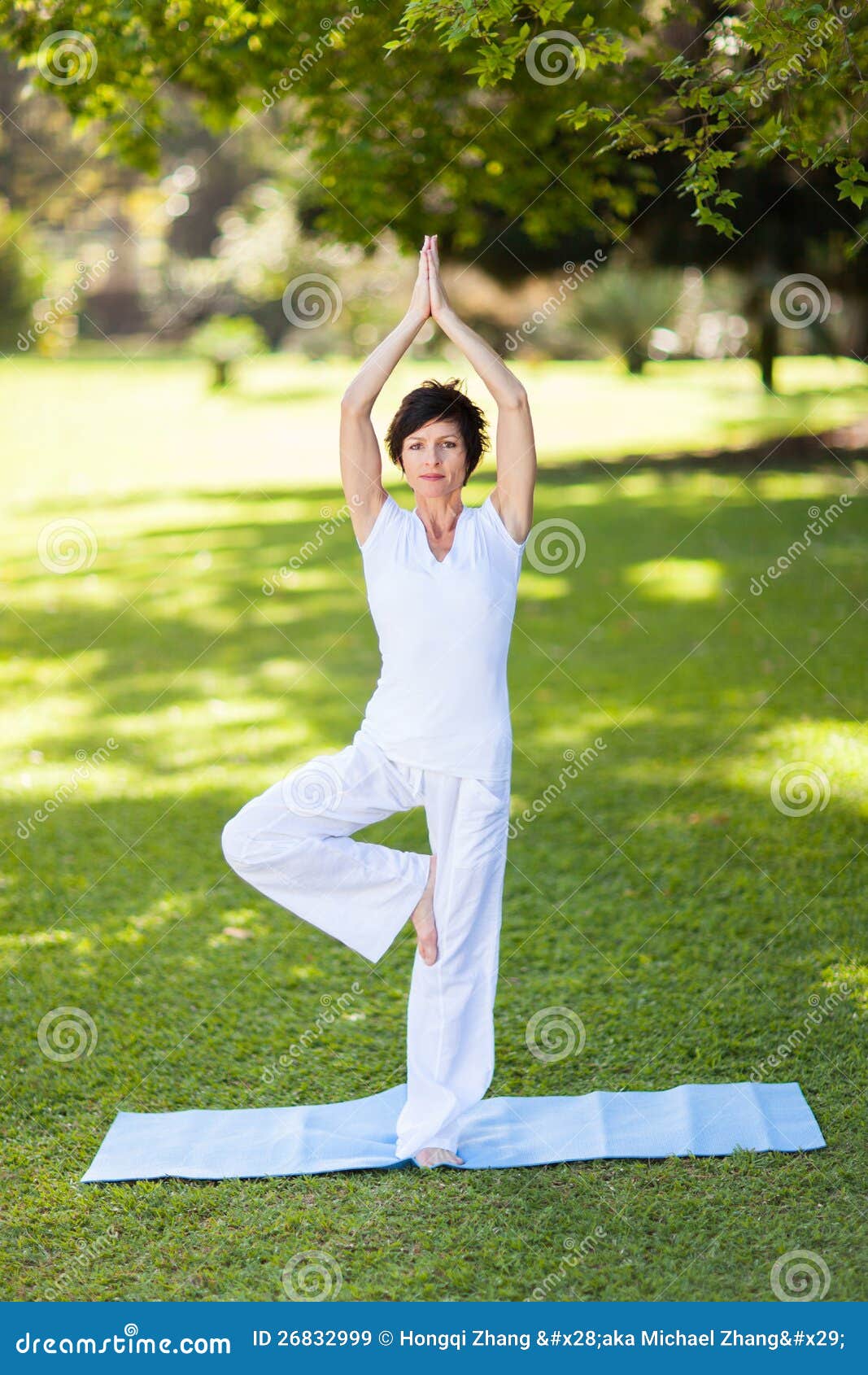 middle-aged woman doing yoga - Stock Image - F003/8652 - Science