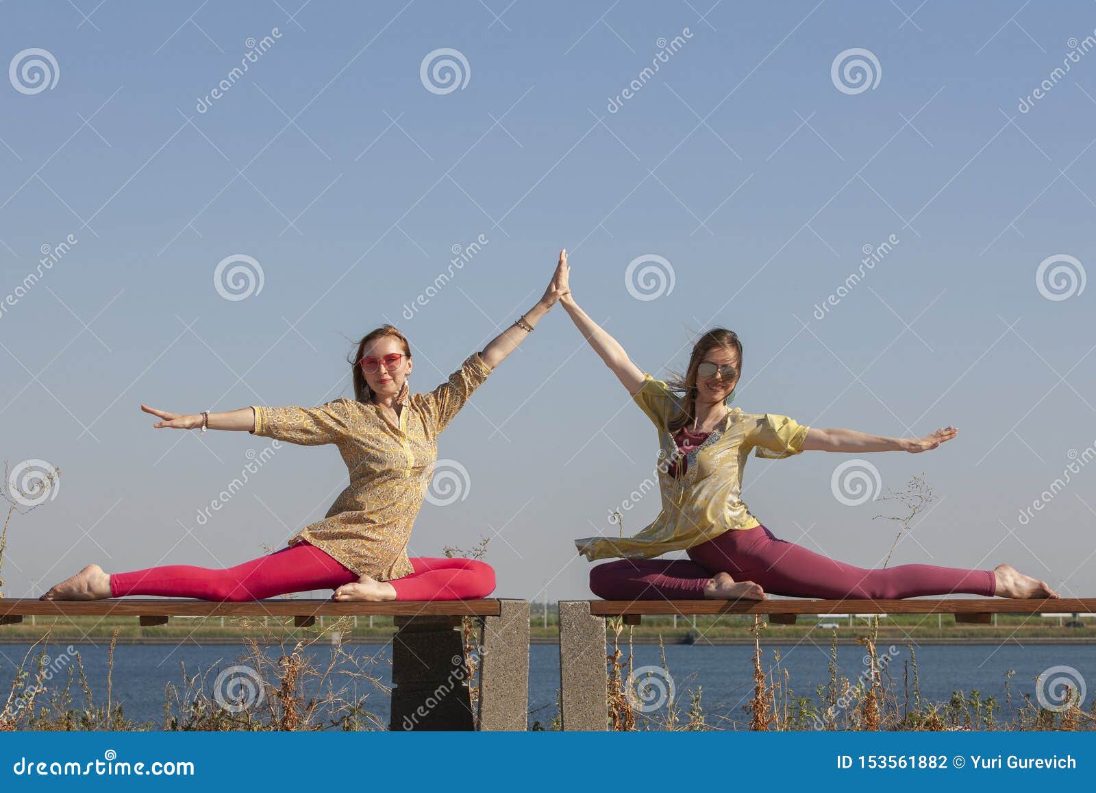 Yo Middle aged woman doing yoga early in the morning in a park royalty free  stock images