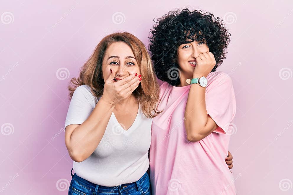Middle East Mother and Daughter Wearing Casual Clothes Laughing and
