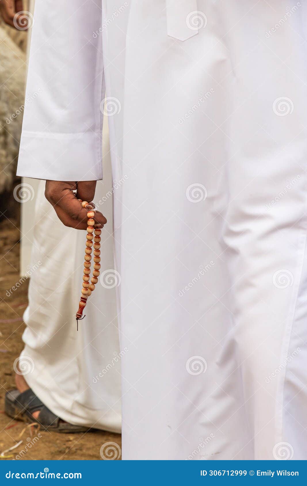 man with prayer beads at the al qassim livestock market