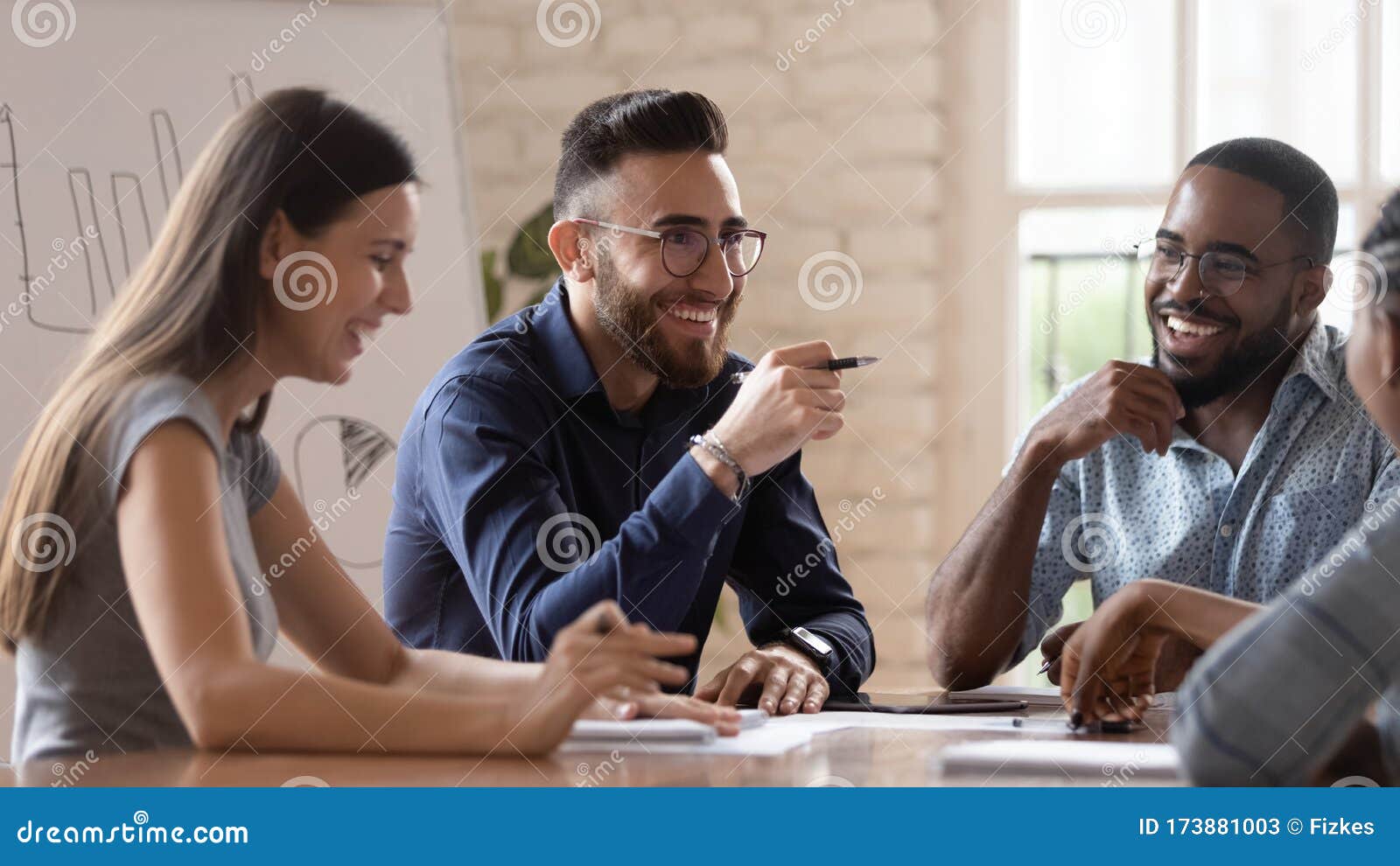 Middle Eastern Ethnicity Employee and Colleagues Talking Sitting at ...