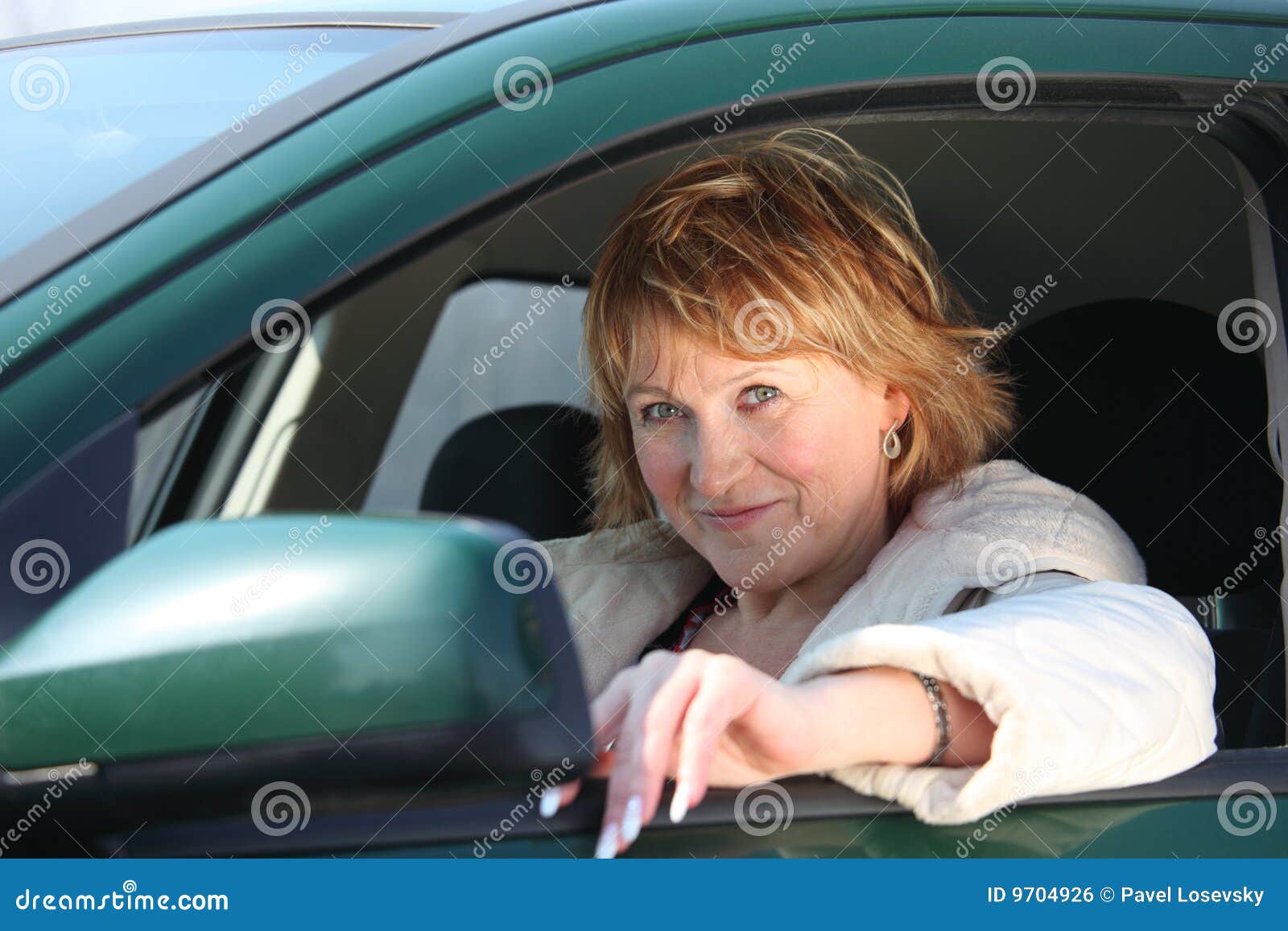 middleaged woman in car