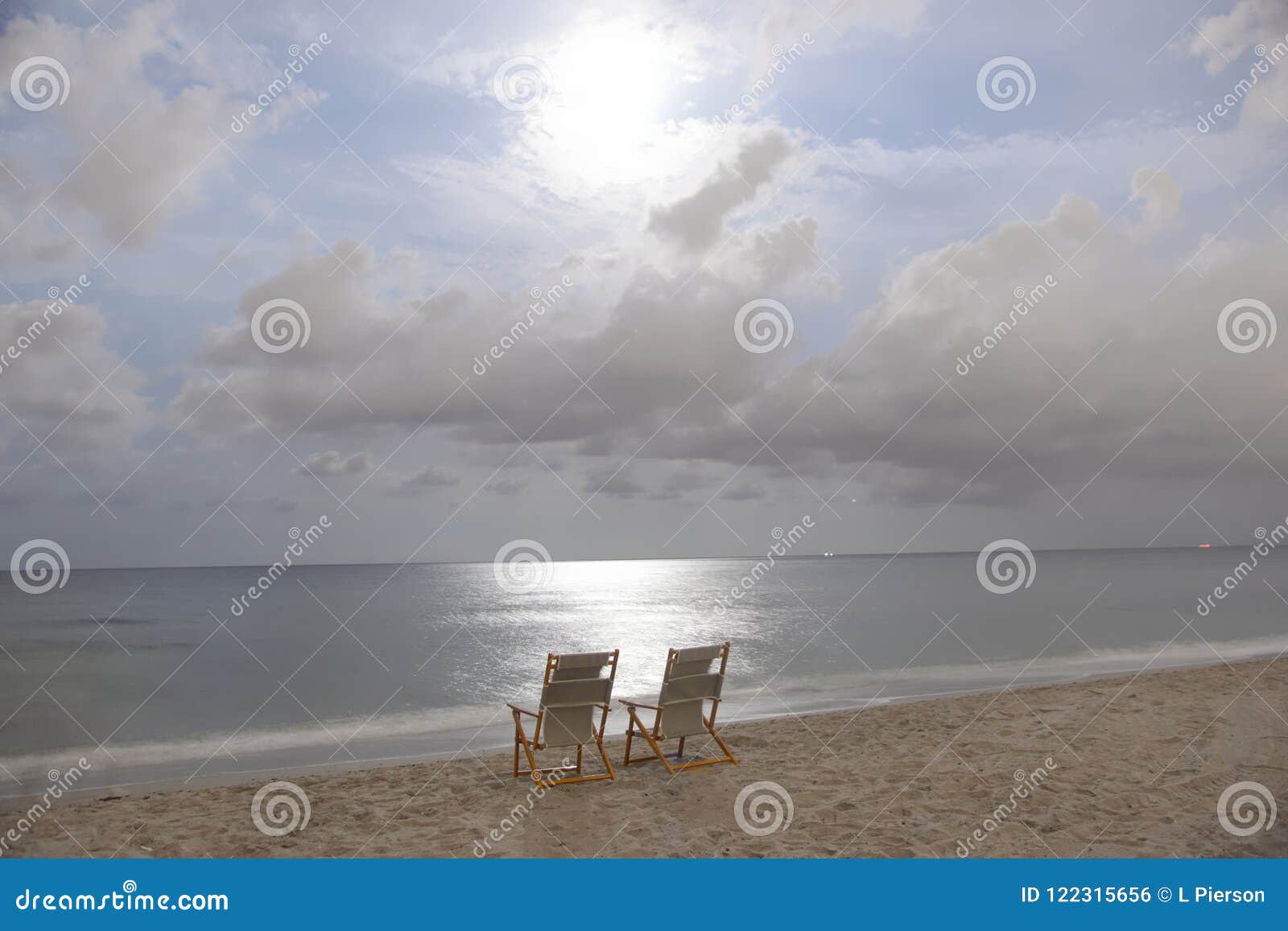 Midnight On A Florida Beach With The Chairs Ready For Their