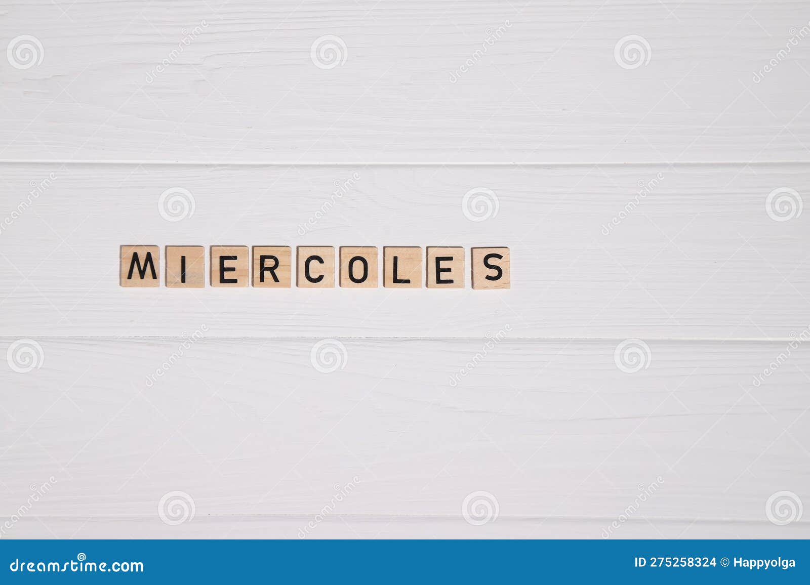 miercoles week day name on white wooden background