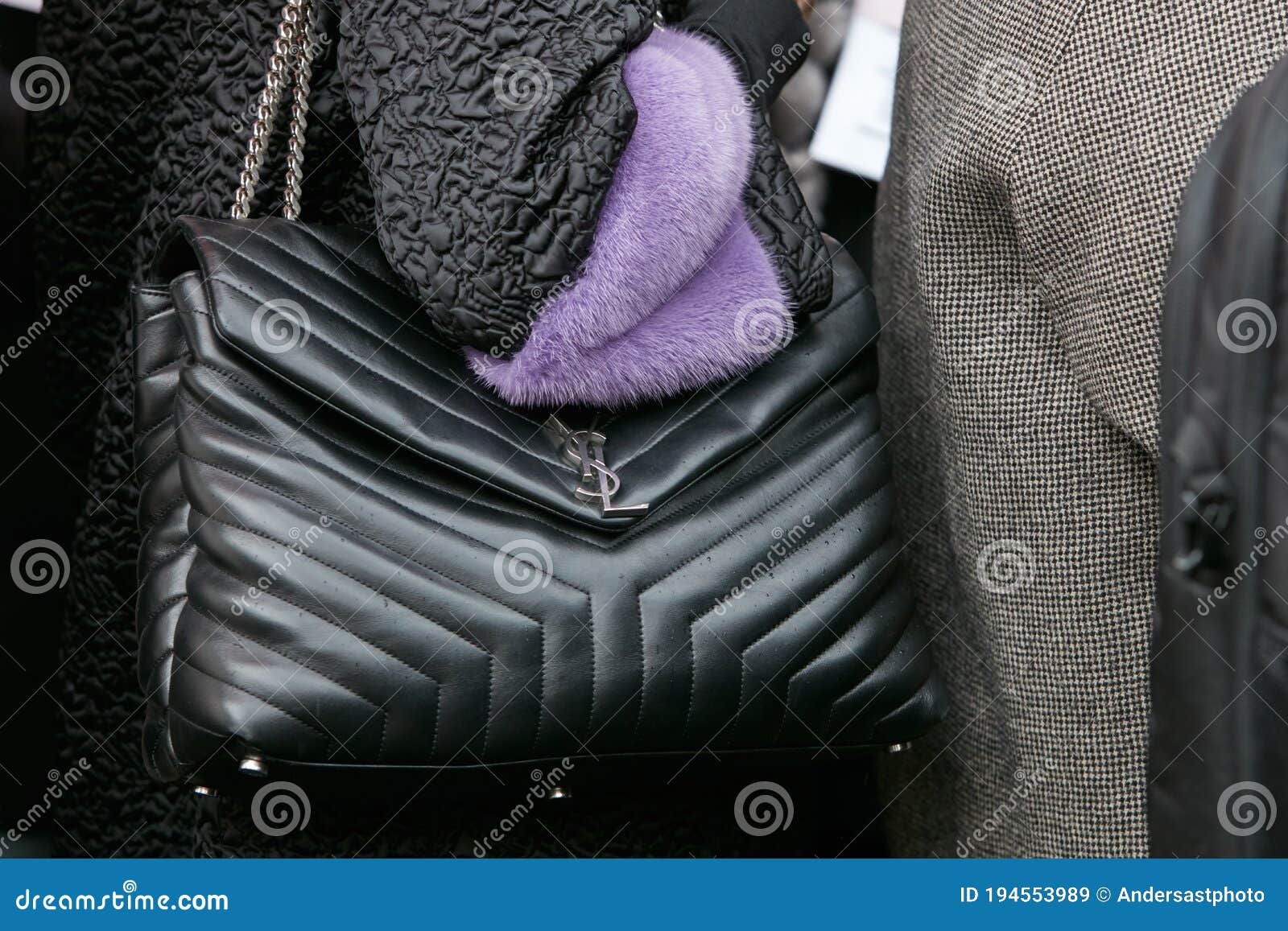 Woman with Black Leather Yves Saint Laurent Bag before Fendi