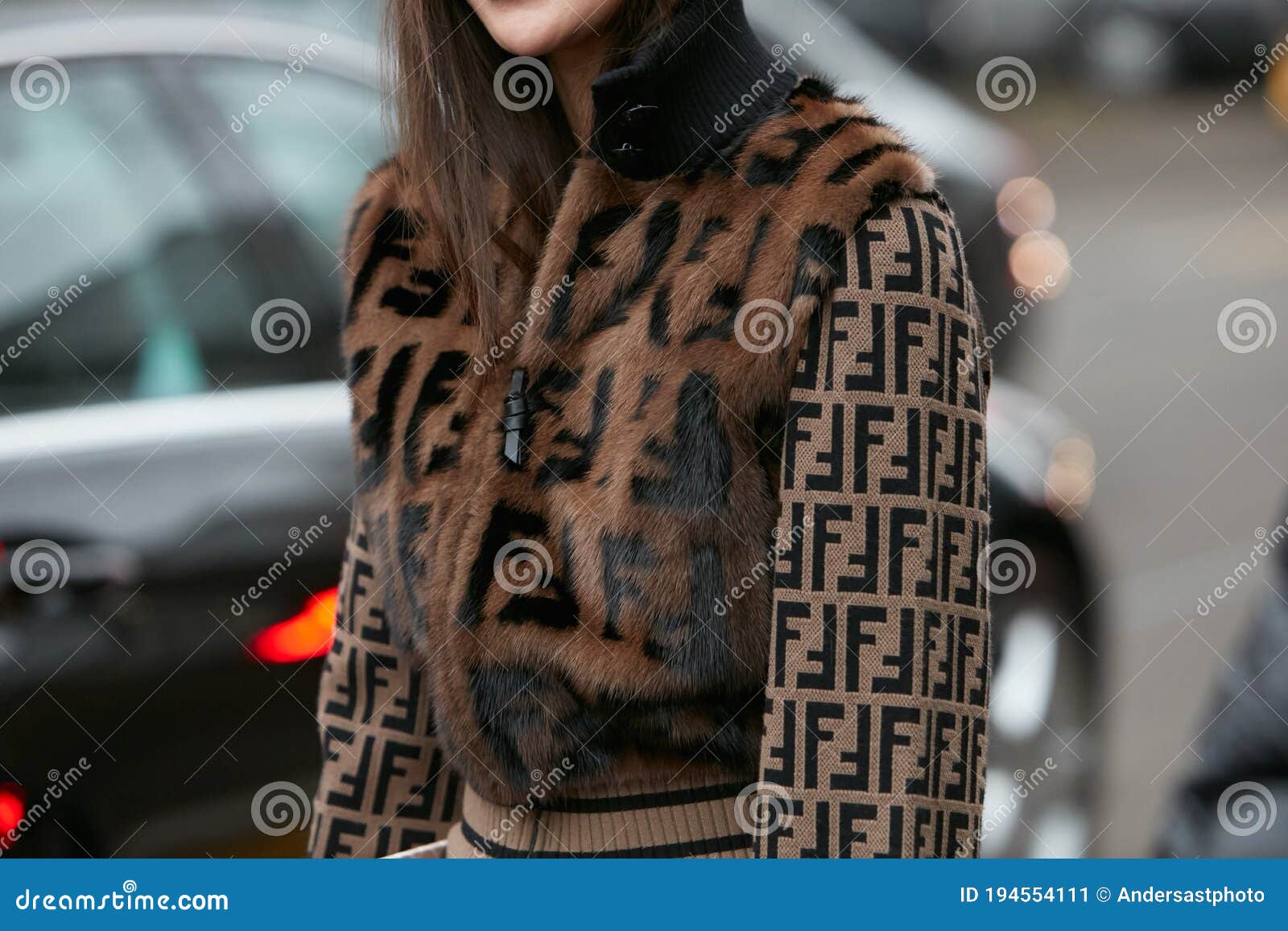 Woman with Brown Leather Fendi Bag and Fur Coat before Emporio