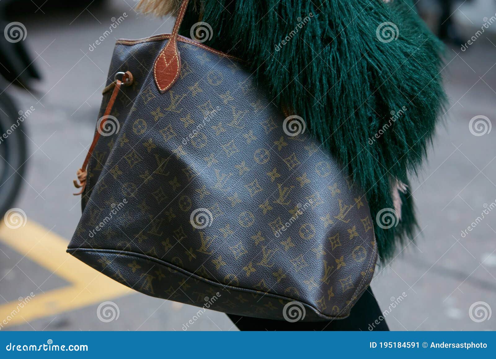 Woman with Louis Vuitton Bag and Green Fur Coat before Blumarine