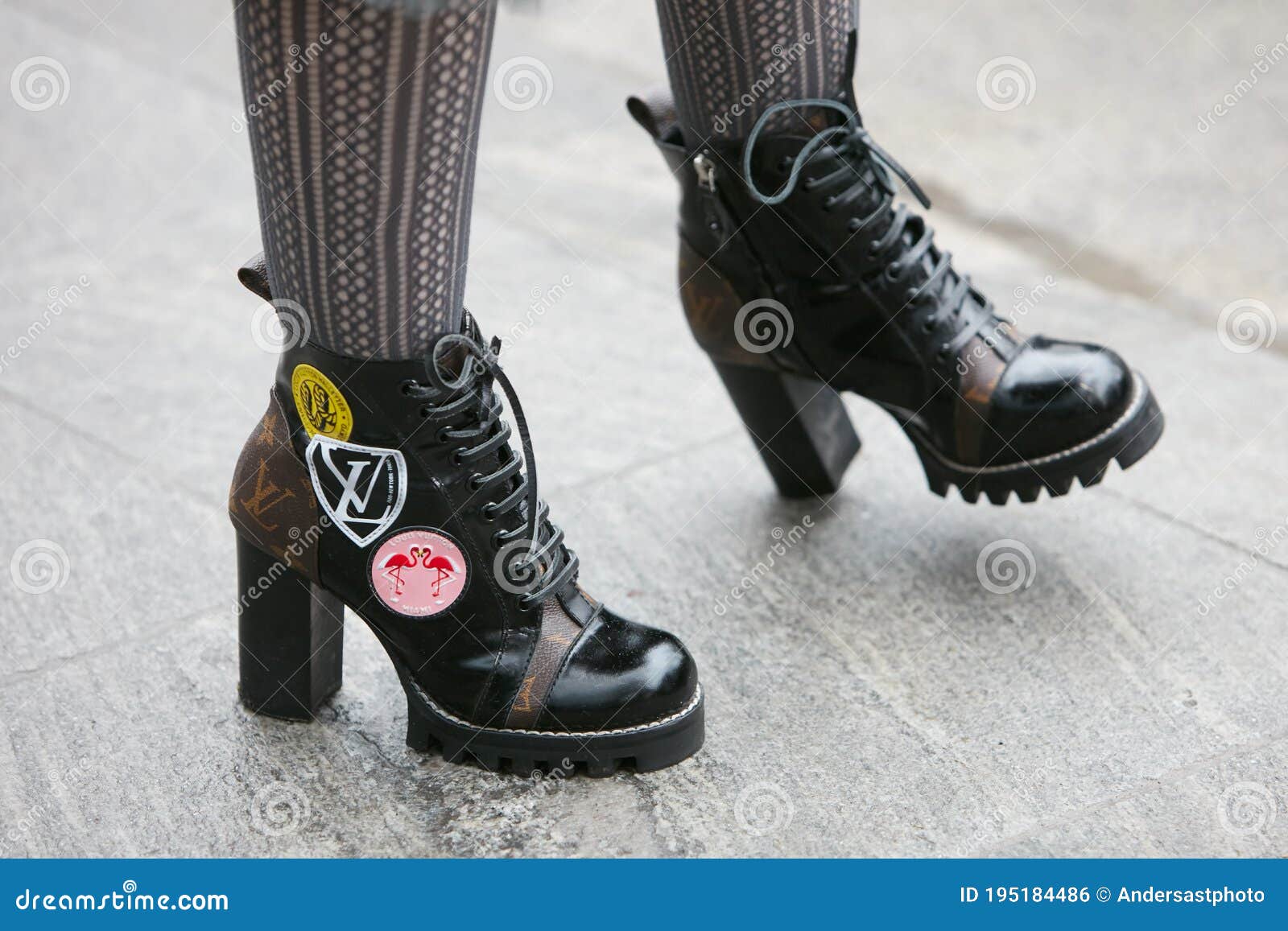 Woman with Louis Vuitton High Heel Boots before Emporio Armani