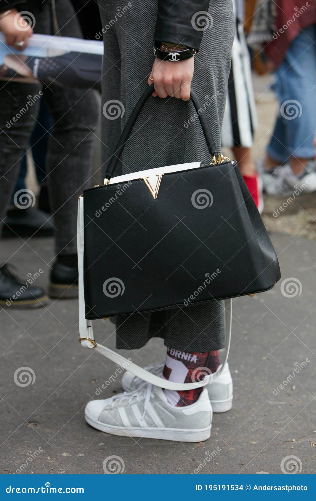 Woman Poses for Photographers with Black and White Louis Vuitton Bag and Adidas  Shoes before Emporio Armani Editorial Stock Image - Image of poses,  february: 195191534