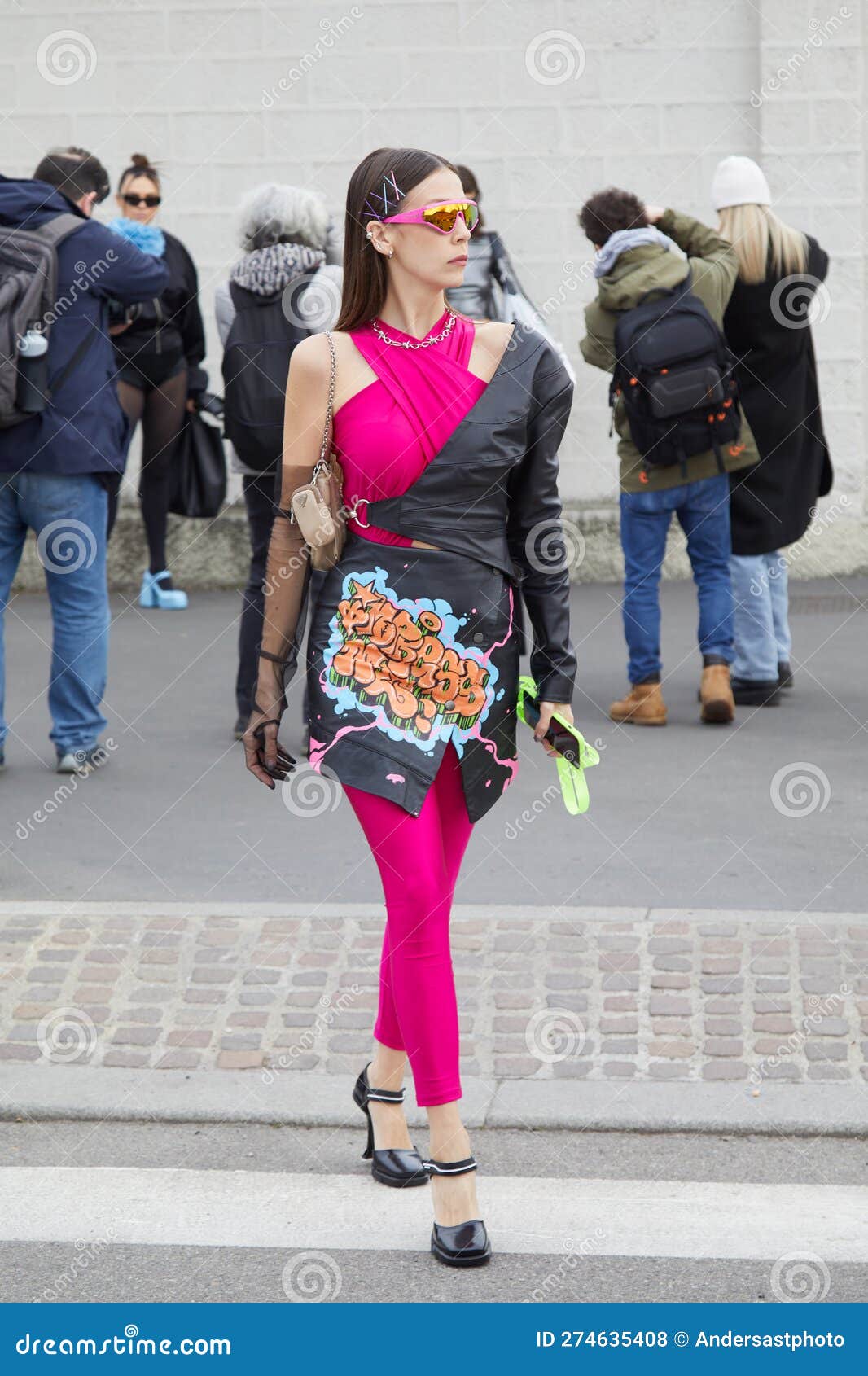 MILAN, ITALY - FEBRUARY 23, 2023: Woman with light pink Prada