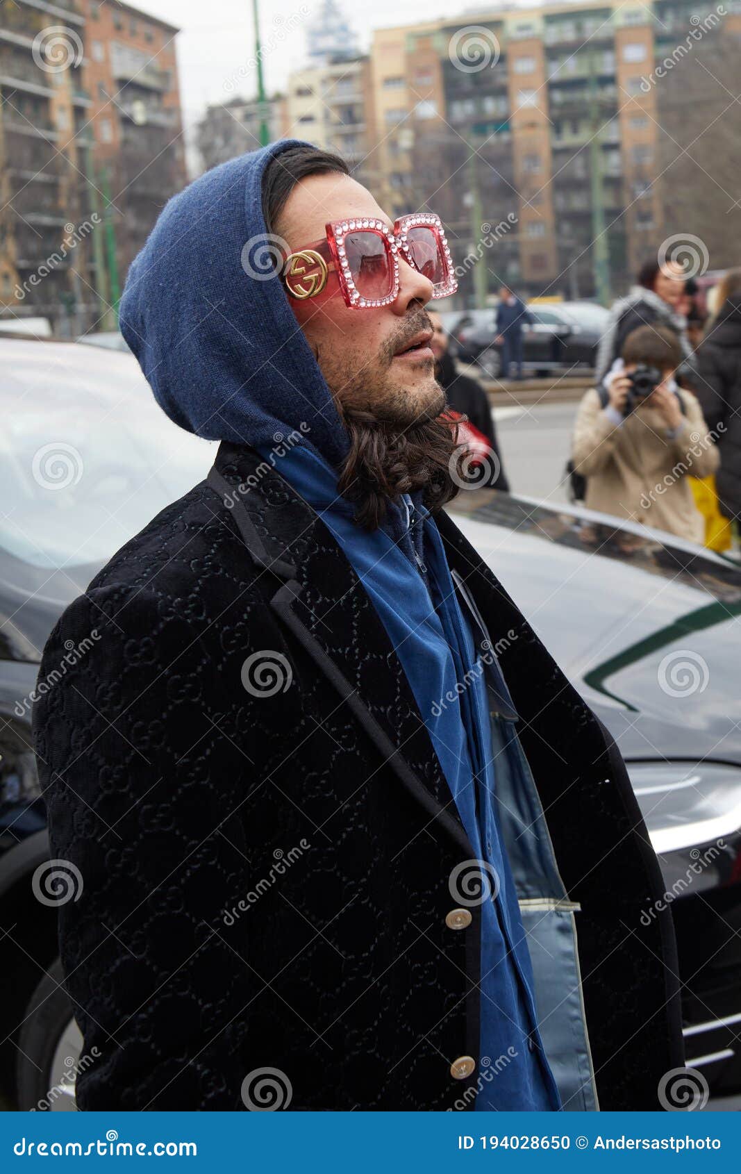 Man with Black Velvet Gucci Jacket and Pink Sunglasses before