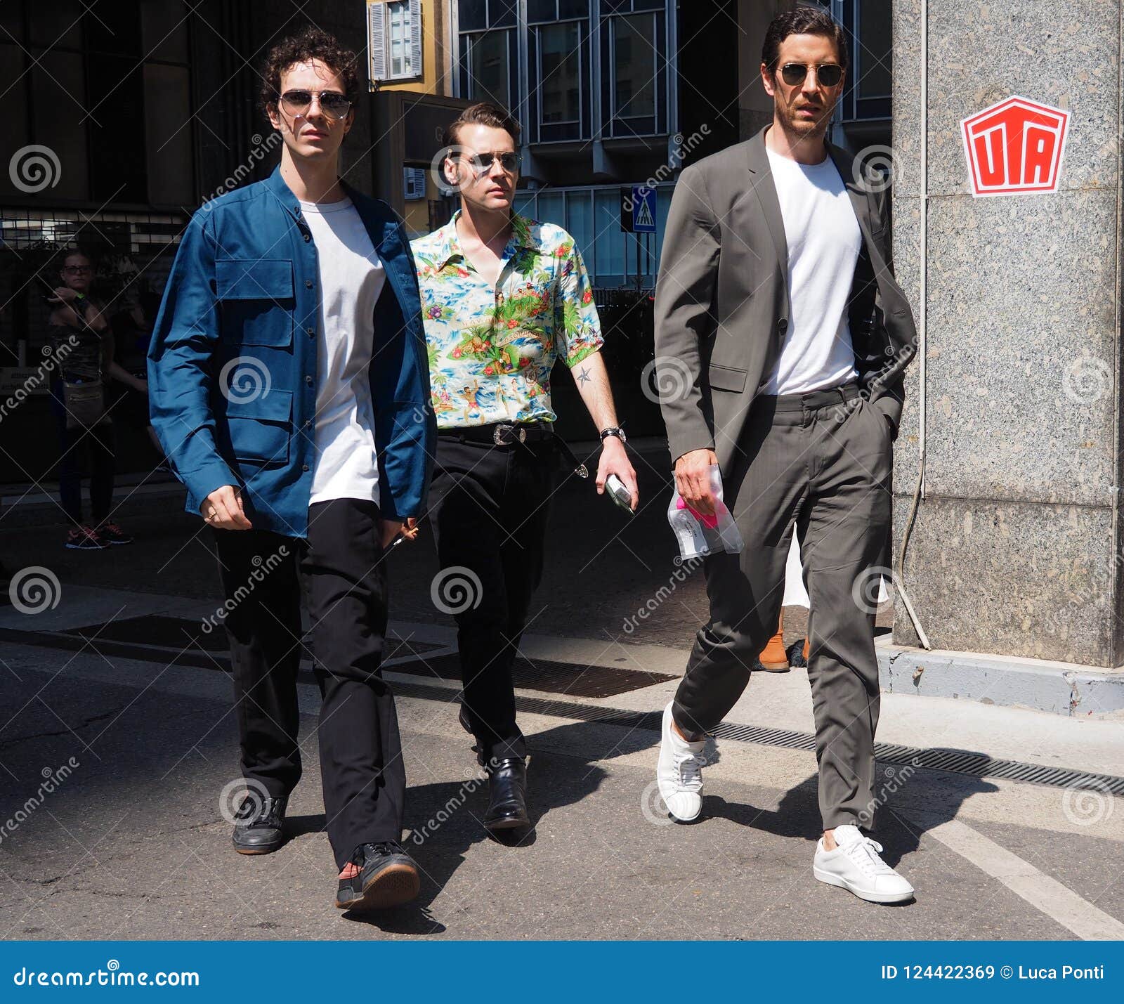 MILAN - JUNE 16: Woman with white and blue Louis Vuitton sneakers walking  before Marni fashion show, Milan Fashion Week street style on June 16, 2018  Stock Photo - Alamy