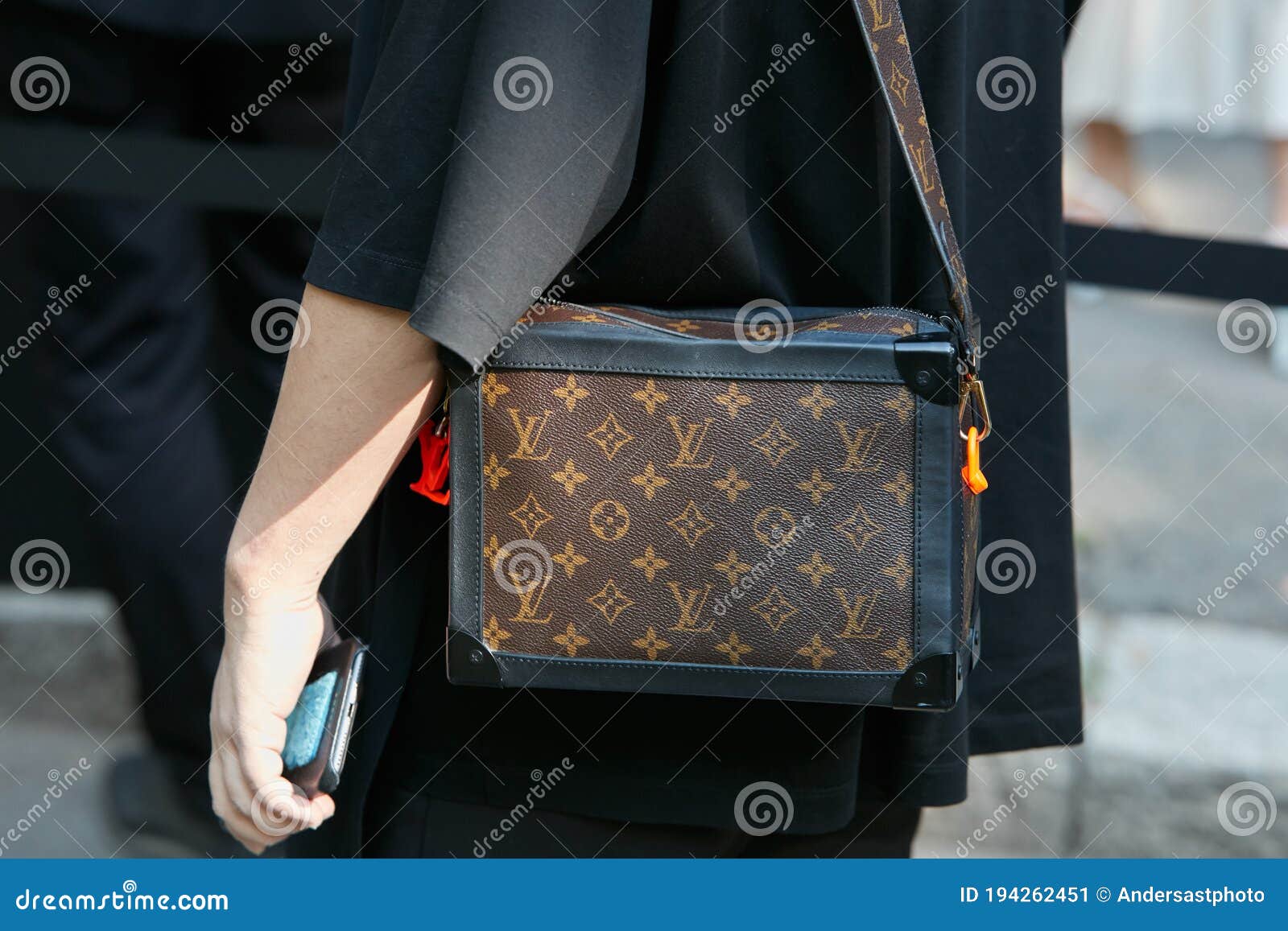 MILAN, ITALY - SEPTEMBER 20, 2018: Woman with Louis Vuitton small bag and  white dress with denim torn cuffs before Fendi fashion show, Milan Fashion  W Stock Photo - Alamy