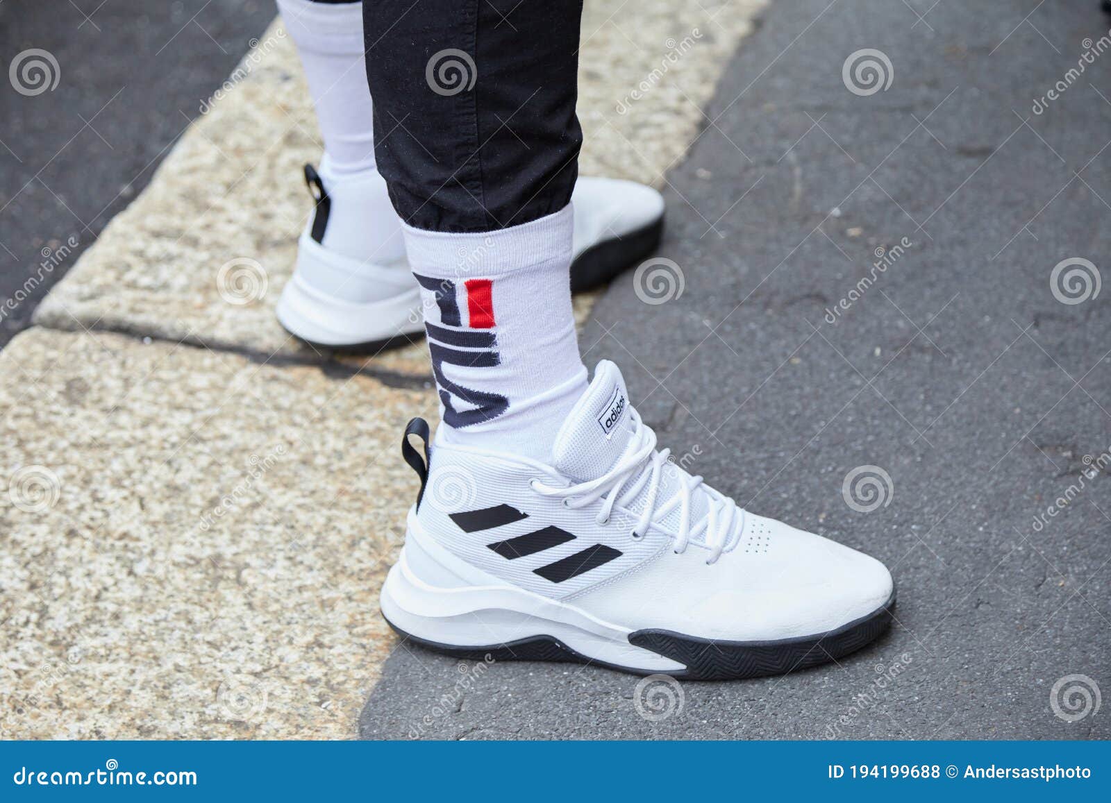 Man with White and Black Adidas Sneakers and Fila Socks before Boss ...
