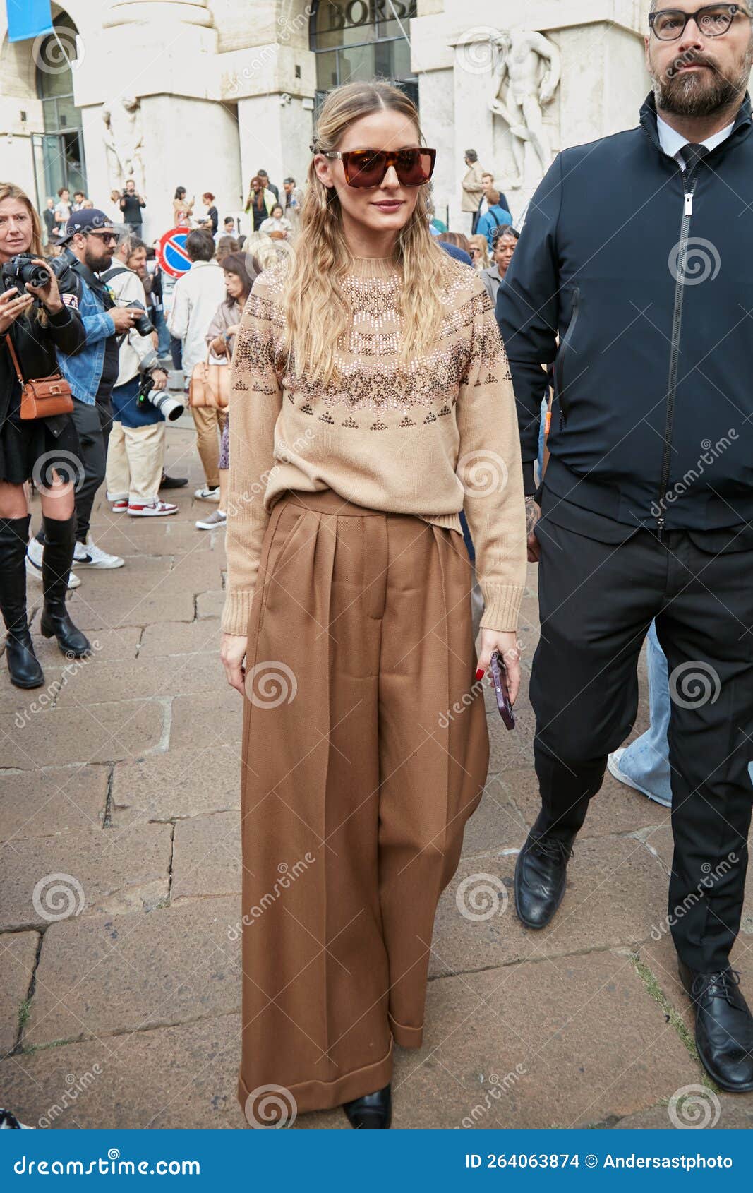 MILAN - SEPTEMBER 21: Women with Chanel black leather bag and floral dress  before Max Mara fashion show, Milan Fashion Week street style on September  Stock Photo - Alamy