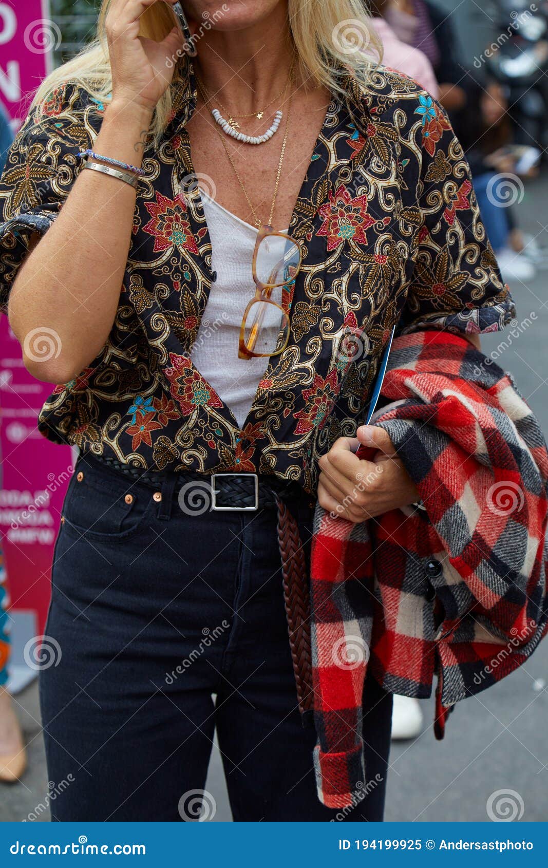 Woman with Black and Golden Floral Design Shirt Speaking at Smartphone ...