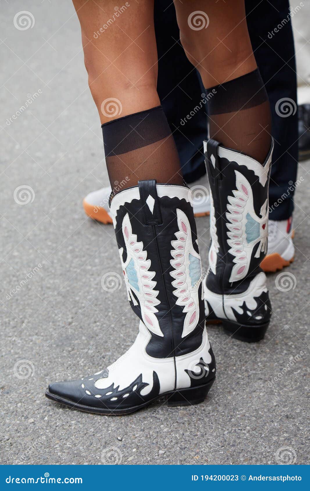 Woman with gray patent leather boots with pink heel before fashion Tod's  show, Milan Fashion Week street style on September 23 Stock Photo - Alamy