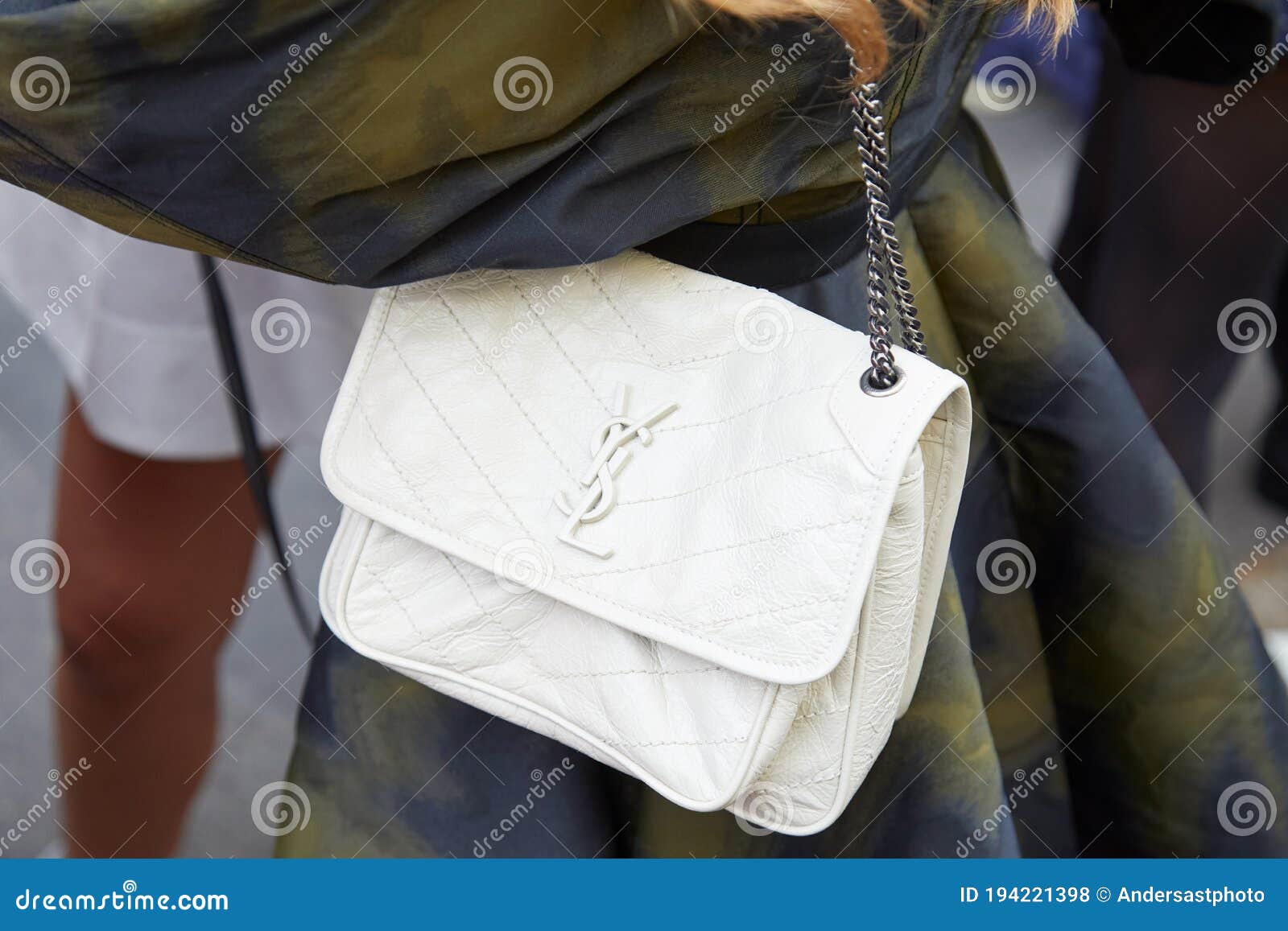 Woman with pink Louis Vuitton leather bag and blue floral trousers before  Salvatore Ferragamo fashion show, Milan Fashion Week, 2017 Stock Photo -  Alamy