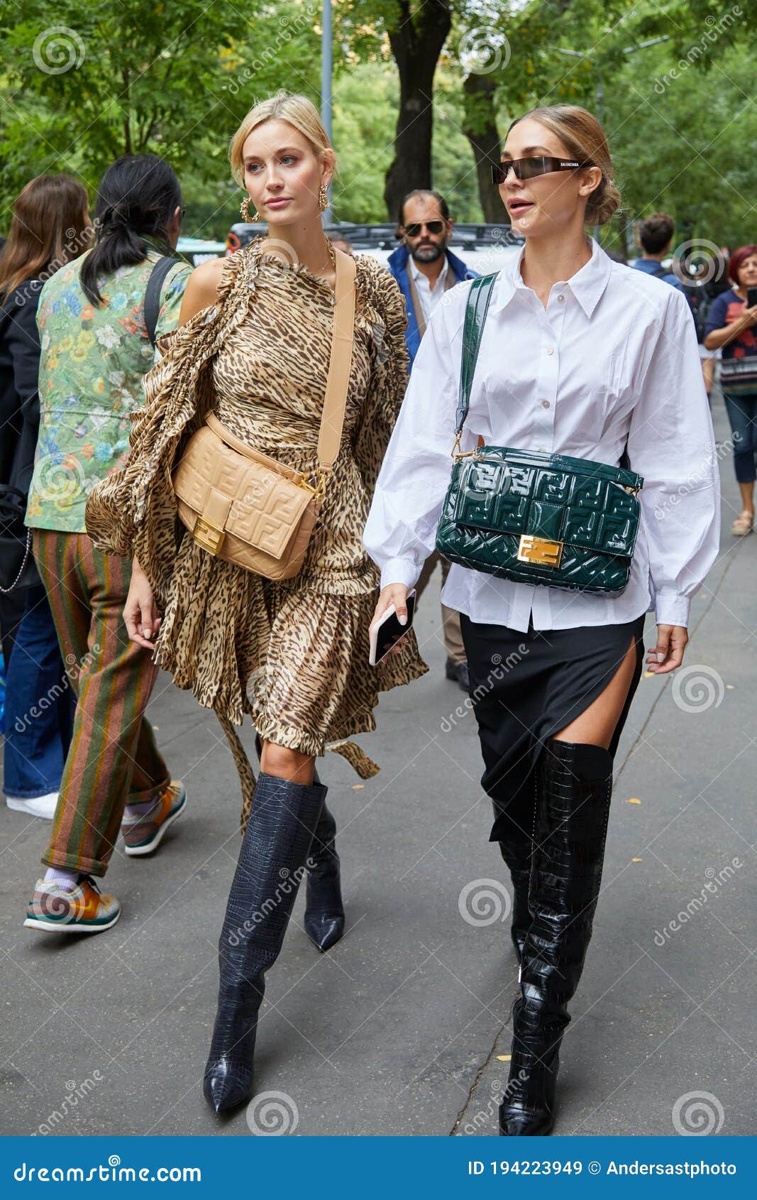 MILAN, ITALY - SEPTEMBER 20, 2018: Woman with Louis Vuitton small bag and  white dress with denim torn cuffs before Fendi fashion show, Milan Fashion  W Stock Photo - Alamy