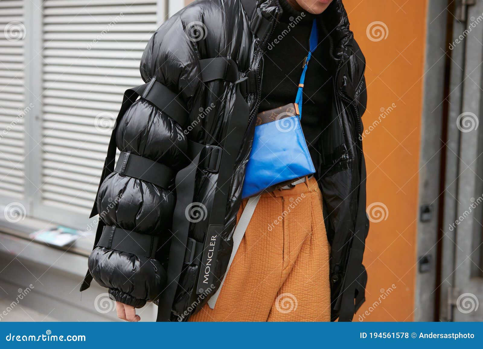 Man with Black Moncler Padded Jacket, Yellow Trousers and Blue Louis Vuitton  Bag before Giorgio Armani Fashion Editorial Stock Photo - Image of people,  outdoor: 194561578