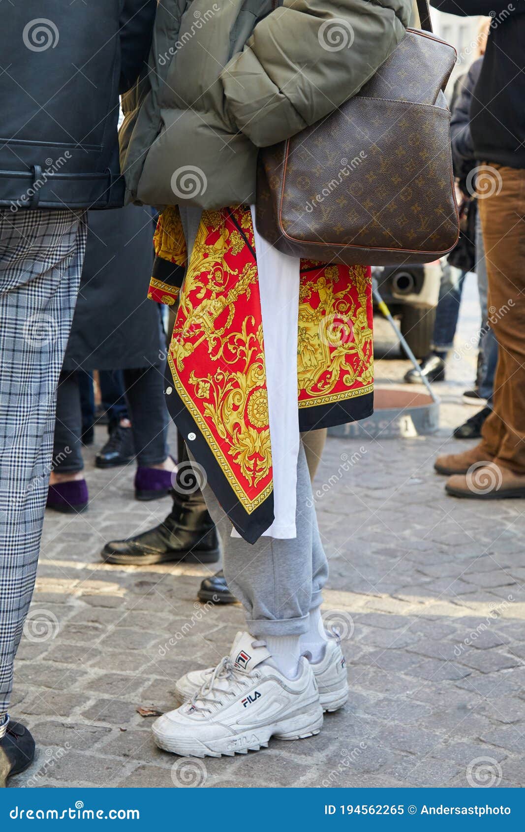 Man with Louis Vuitton Bag and Fila White Sneakers before Daks Fashion Show, Milan Fashion Week Street Style Editorial - Image of vuitton, milan: 194562265
