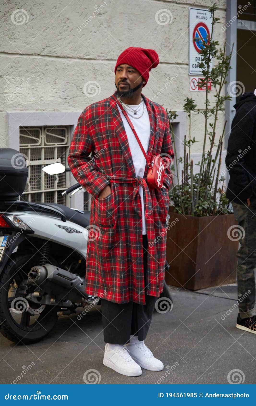 Man with red tartan coat and red Supreme Louis Vuitton bag before Represent  fashion show, Milan Fashion Week street style on January 15, 2018 in Milan.  – Stock Editorial Photo © AndreaA. #272284212