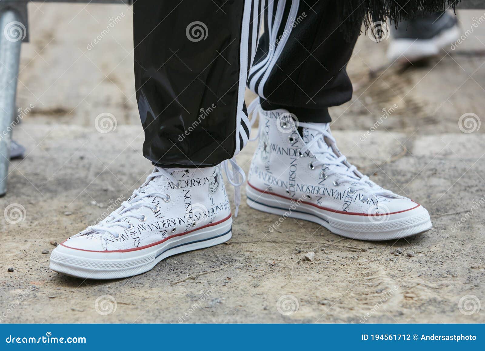 Man with White JW Anderson Converse Shoes and Black Adidas Trousers before  Fendi Fashion Show, Milan Fashion Editorial Photography - Image of week,  adidas: 194561712