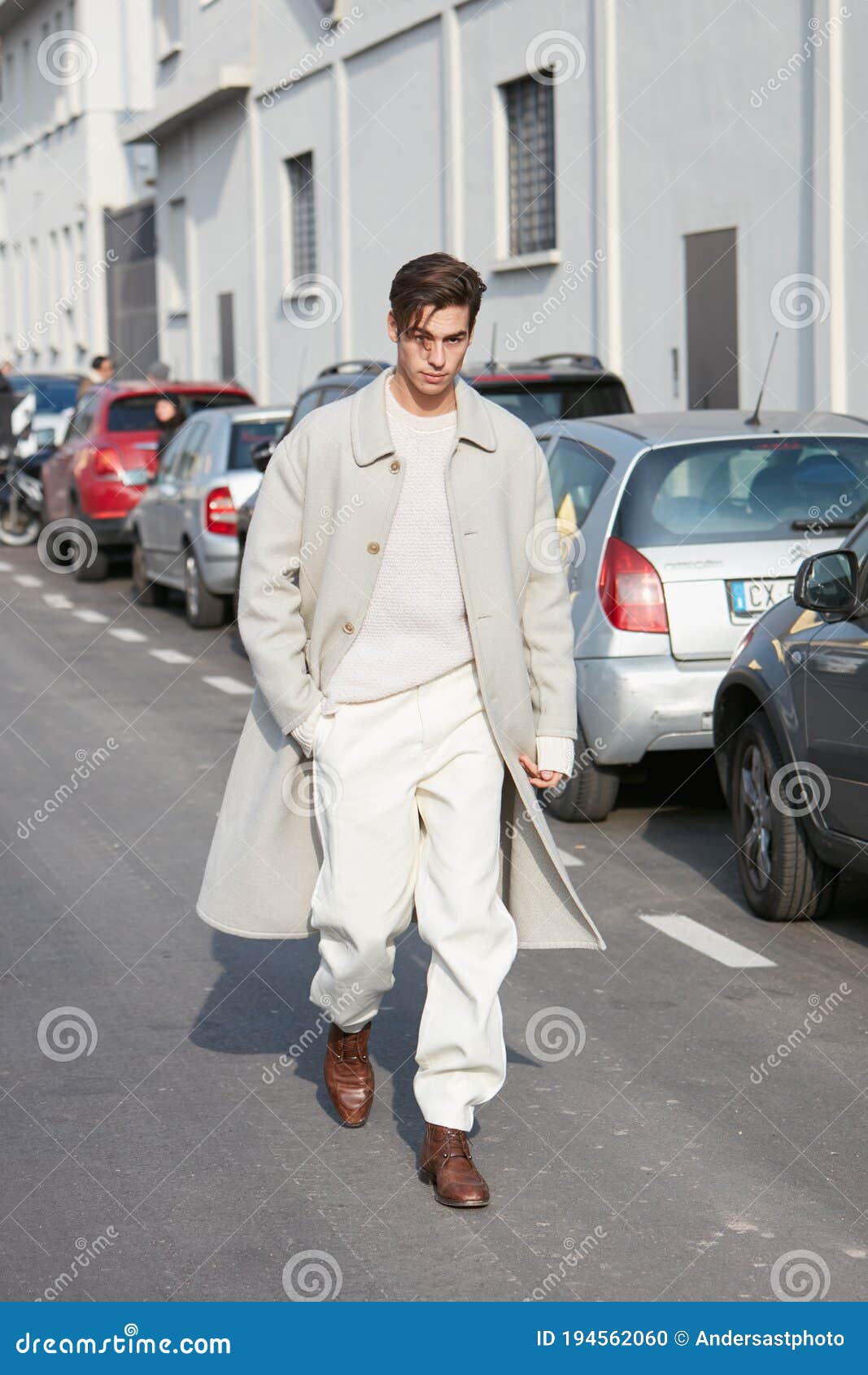 MILAN - JANUARY 13: Man with white leather Prada bag and black and white  jacket before Marni fashion show, Milan Fashion Week street style on  January Stock Photo - Alamy