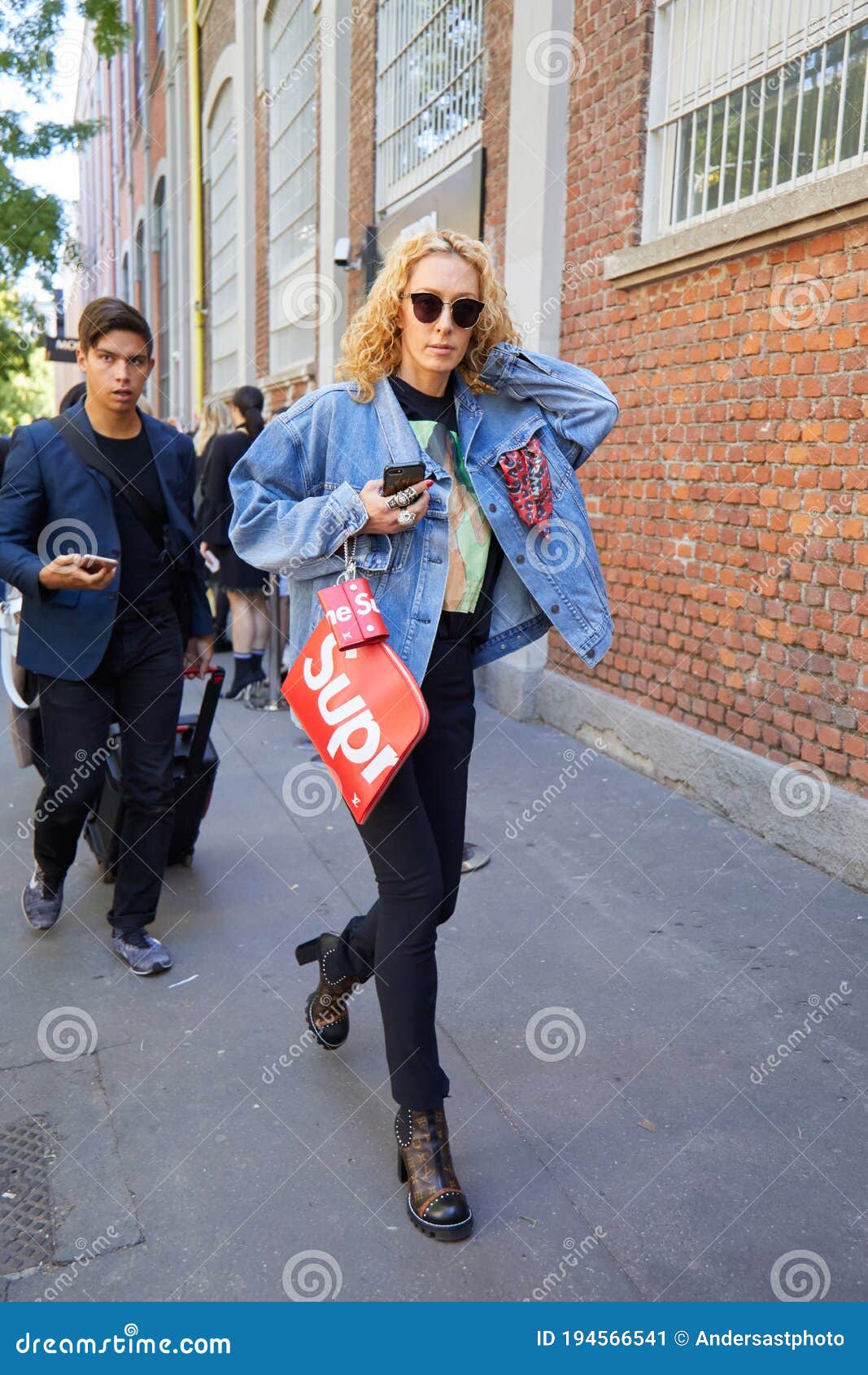 Elina Halimi with Jeans Jacket and Red Supreme Bag before Fendi Fashion Show,  Milan Fashion Week Street Editorial Photo - Image of italy, elina: 194566541