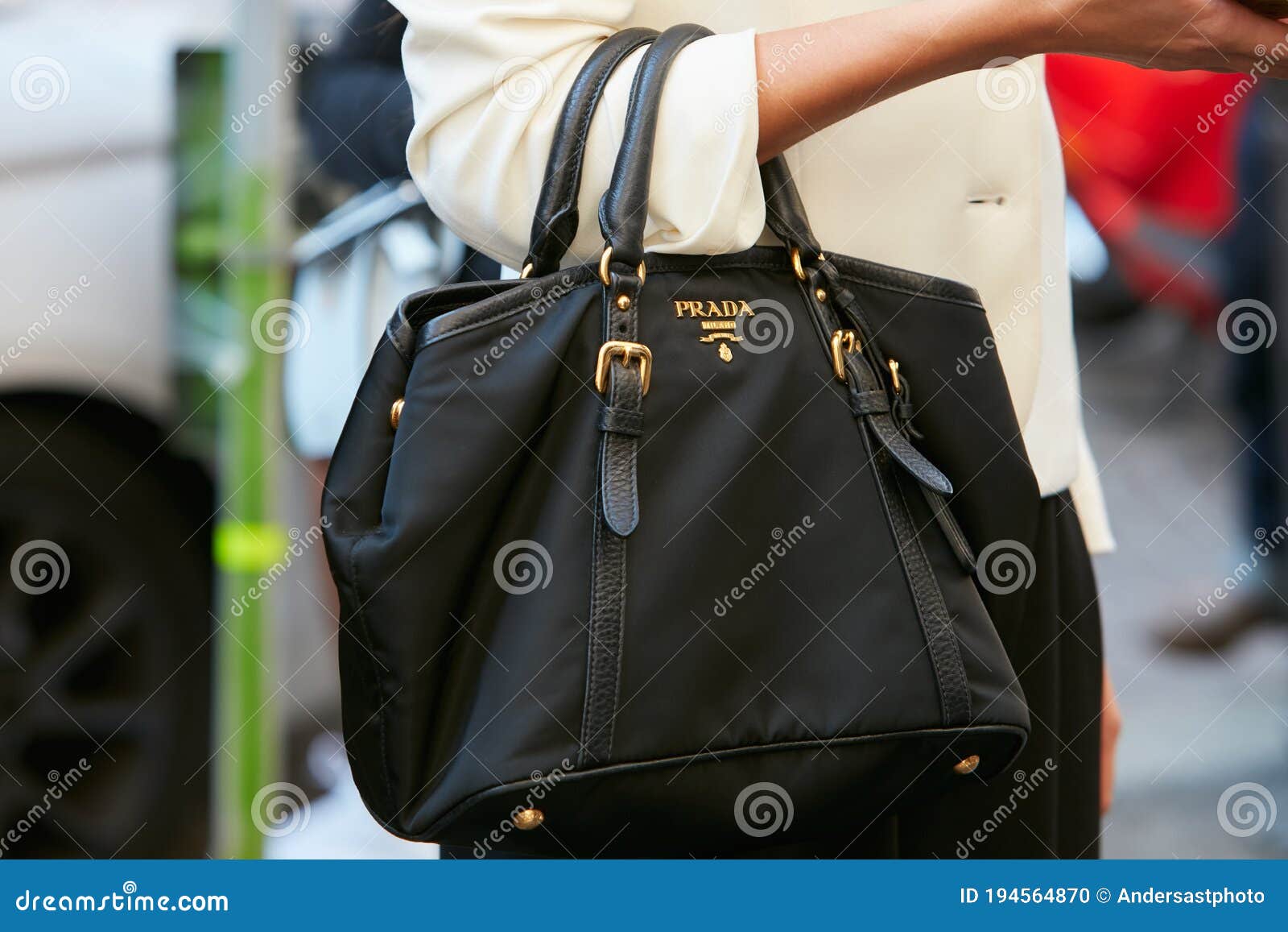 Woman with Black Prada Bag with Golden Logo and White Jacket before  Blumarine Fashion Show, Milan Fashion Editorial Image - Image of elegant,  logo: 194564870