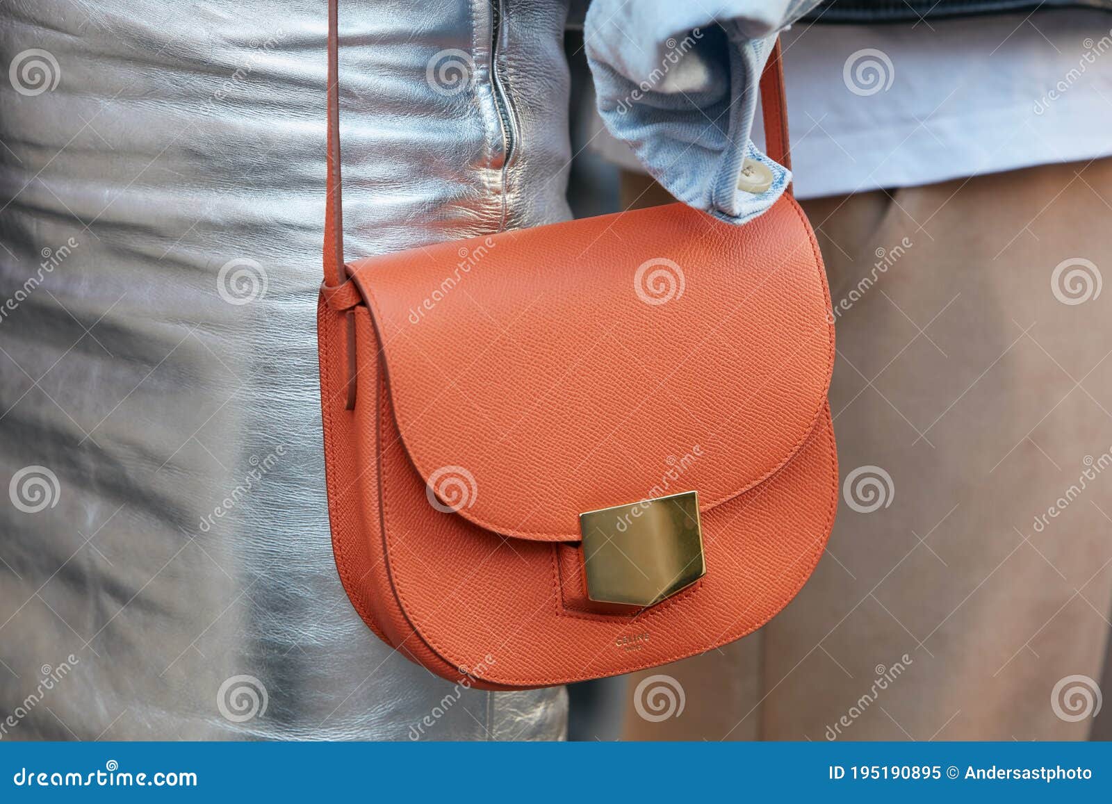 Woman with pink and brown Louis Vuitton bag and pink suit on February 25,  2016 in Milan, Italy Stock Photo