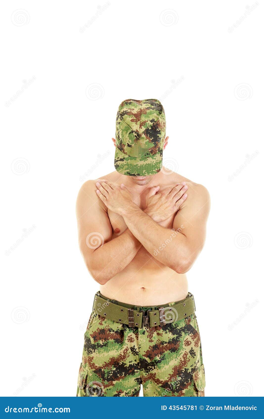 military combatant officer praying with arms crossed and head bo