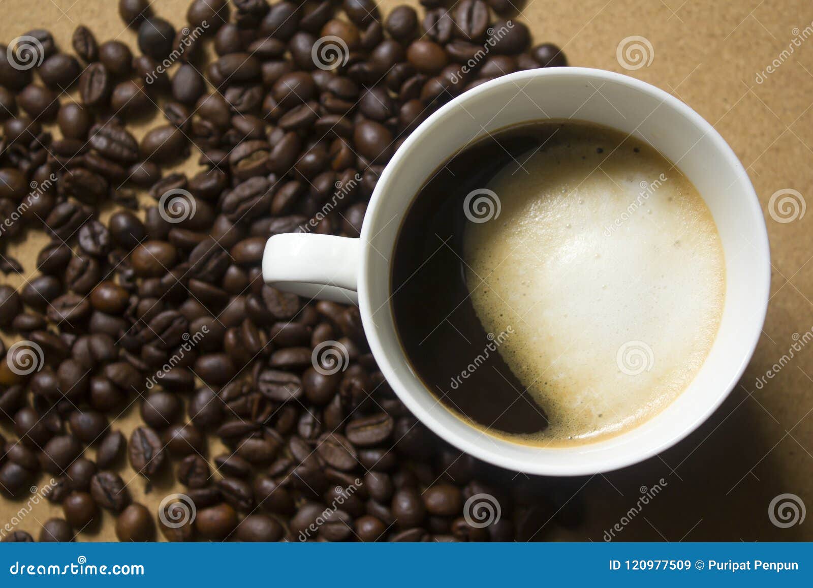 milk froth in coffee mugs and coffee beans