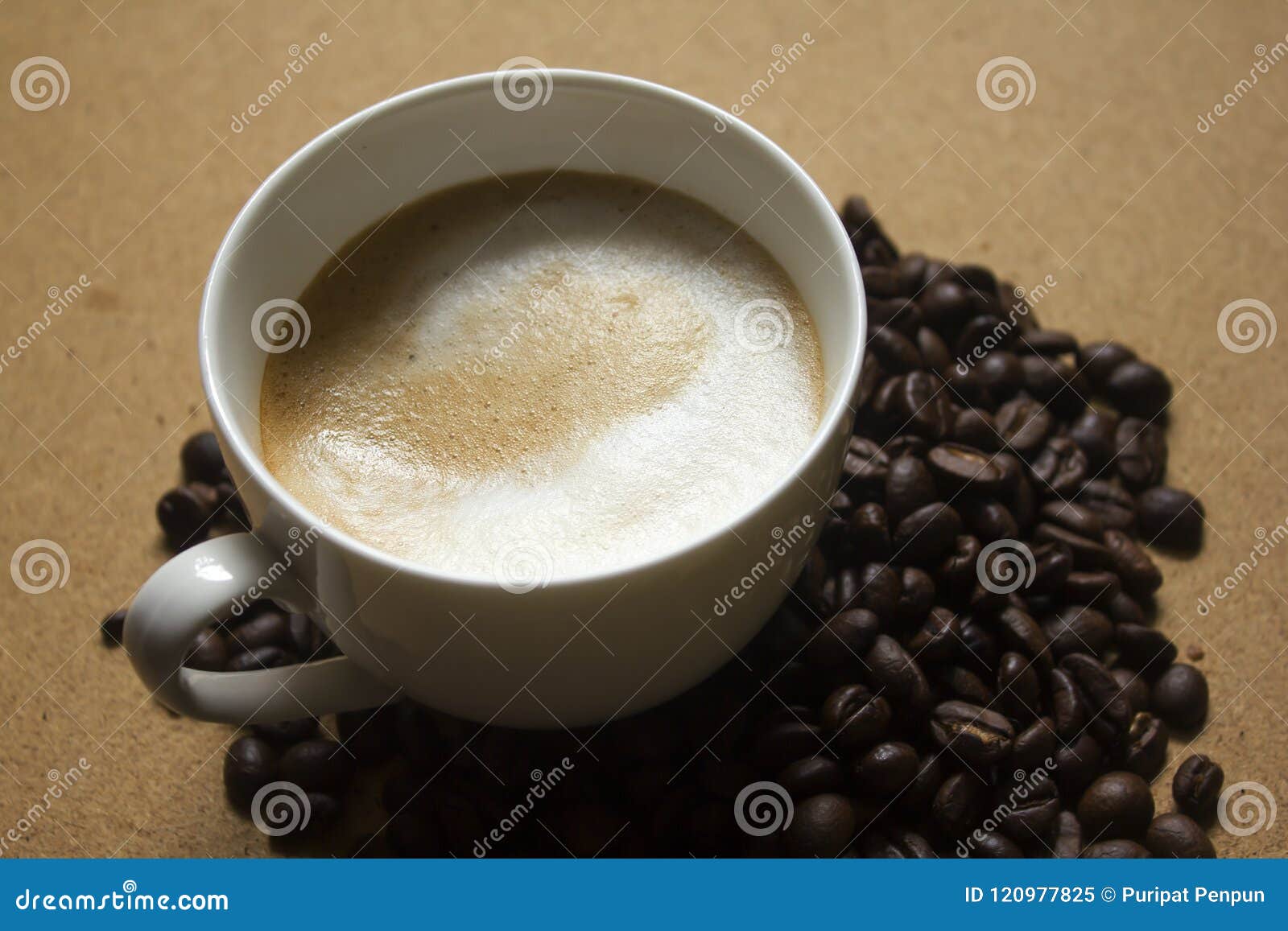 milk froth in coffee mugs and coffee beans