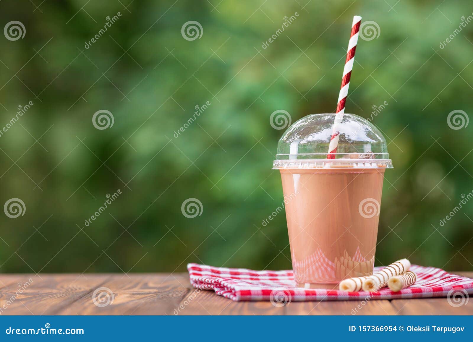 https://thumbs.dreamstime.com/z/milkshake-disposable-plastic-cup-chocolate-milkshake-disposable-plastic-cup-wafer-rolls-wooden-table-outdoors-157366954.jpg