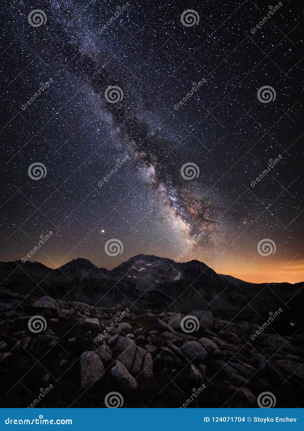 milky way galaxy and mountain peaks.