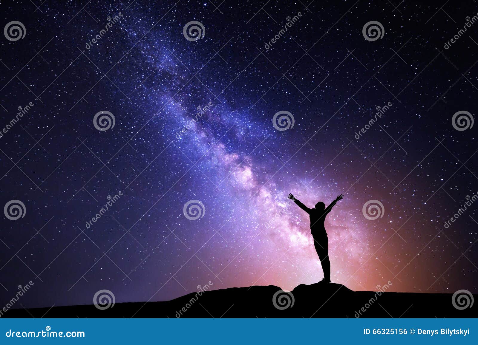 milky way. night sky and silhouette of a standing girl