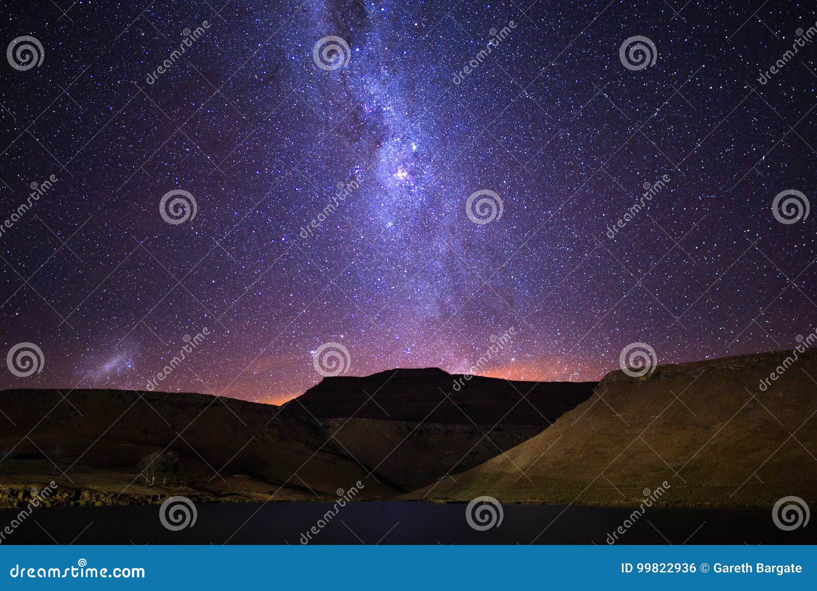 milky way rising over mountain range