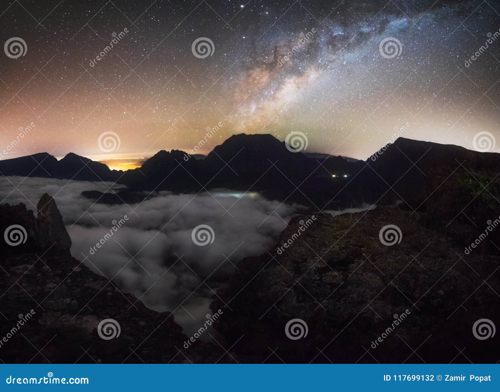 milkyway at maido over a sea of clouds in saint paul, reunion island