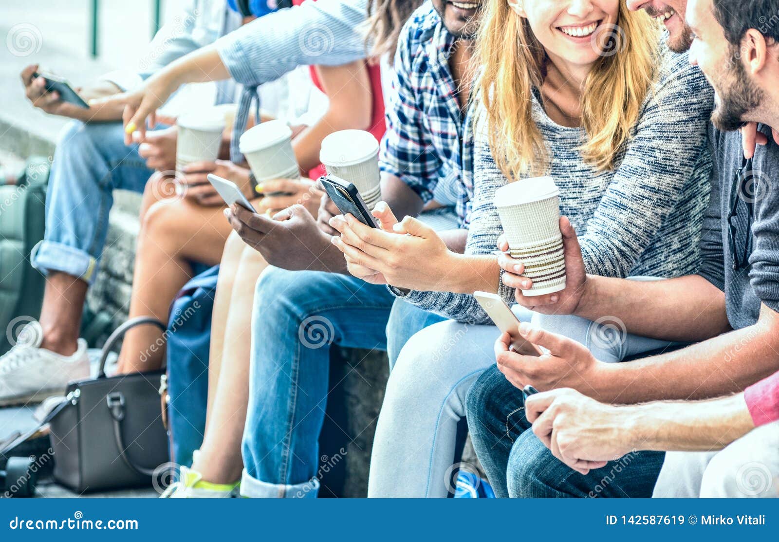 millenial friends group using smartphone with coffee at university college - people hands addicted by mobile smart phone