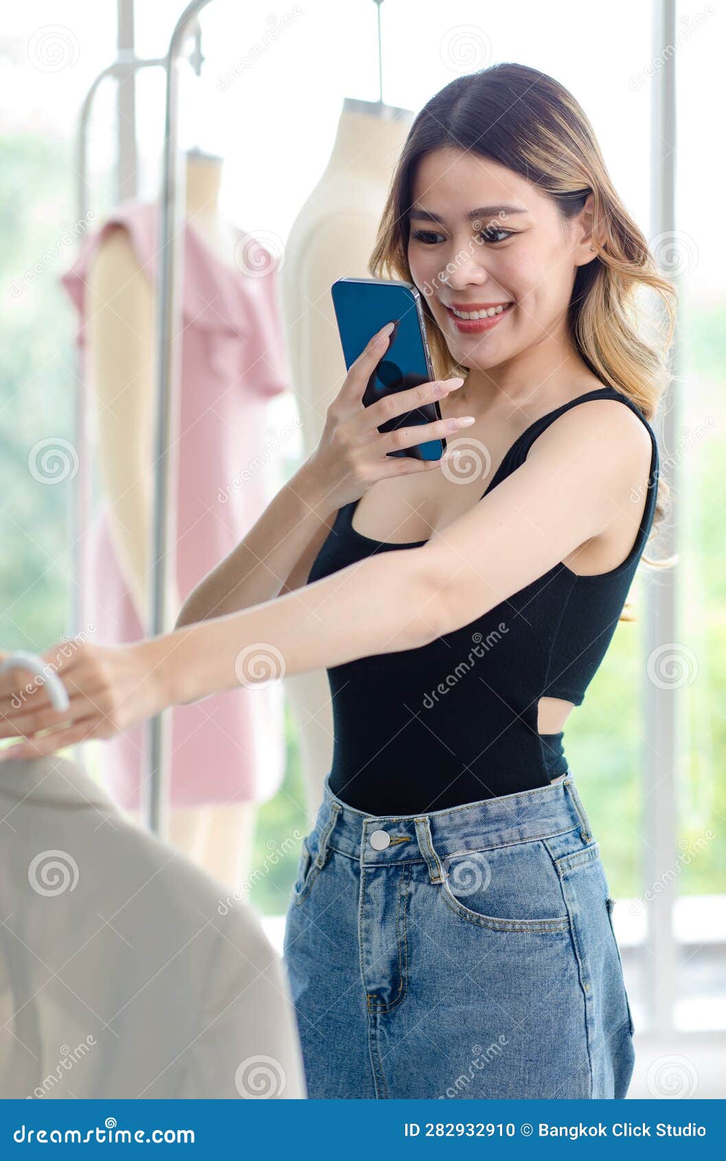 Millennial Asian Young Beautiful Female Customer in Casual Tank Top and Jeans  Outfit Standing Smiling Looking Choosing Dress Stock Photo - Image of  dressmaker, atelier: 282932910
