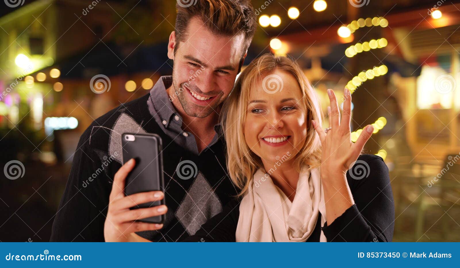 Millennial Girlfriend Taking Selfies with Her New Engagement Ring Stock