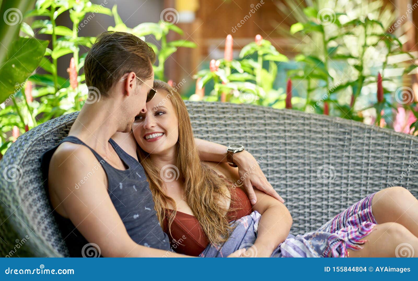 Happy Caucasian Couple Relaxing in Modern Chair of Luxurious Villa in ...