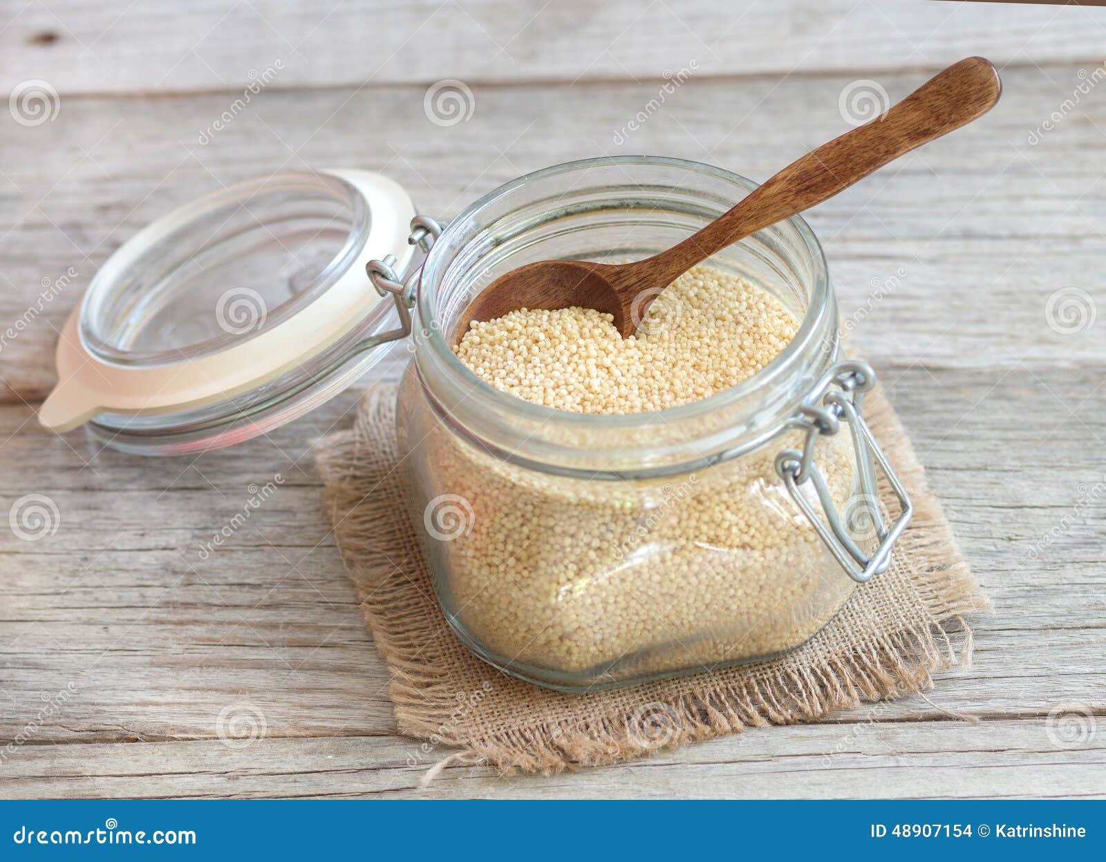 Millet in a glass jar stock photo. Image of uncooked 48907154